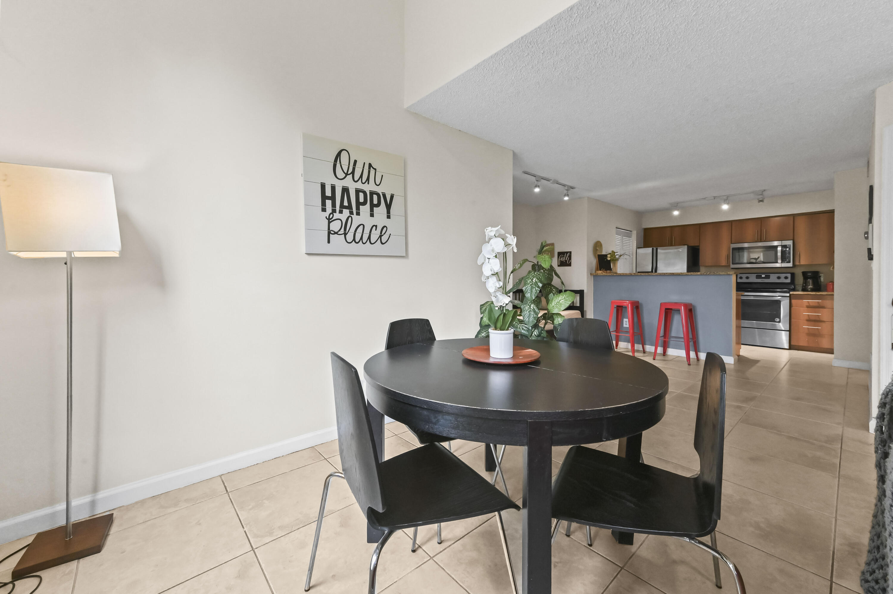 1205 Crystal Way, Unit K Delray Beach, FL 33444 - Photo 2 of 25 a view of a dining room with furniture