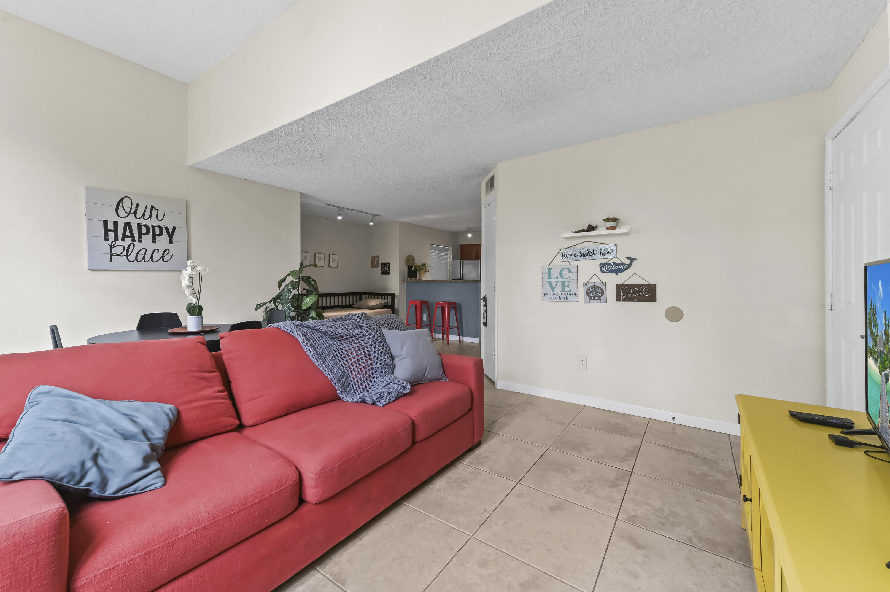 1205 Crystal Way, Unit K Delray Beach, FL 33444 - Photo 5 of 25 a living room with furniture and a couch