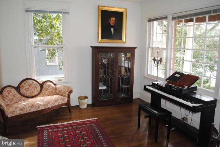 1403 Foxhall Road Northwest Washington, DC 20007 - Photo 2 of 22 a bedroom with furniture and a window