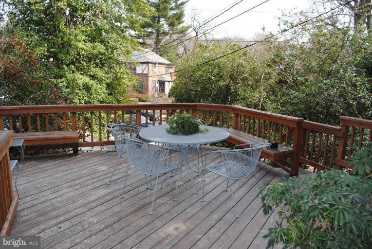 1403 Foxhall Road Northwest Washington, DC 20007 - Photo 12 of 22 a view of a roof deck with wooden floor and fence