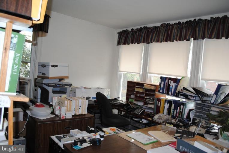 1403 Foxhall Road Northwest Washington, DC 20007 - Photo 20 of 22 a view of a workspace with furniture and a window