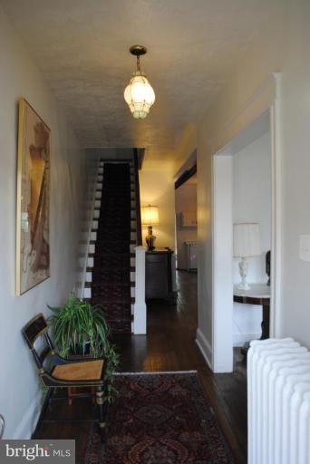1403 Foxhall Road Northwest Washington, DC 20007 - Photo 4 of 22 a living room with furniture and a potted plant