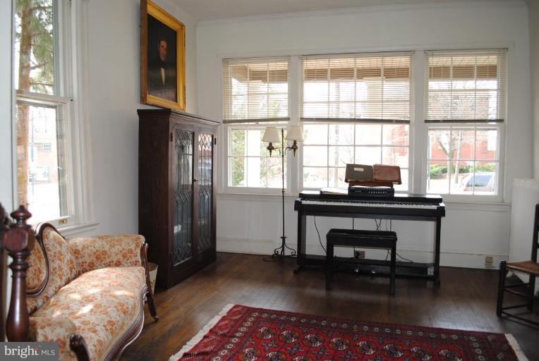 1403 Foxhall Road Northwest Washington, DC 20007 - Photo 5 of 22 a living room with furniture and a window