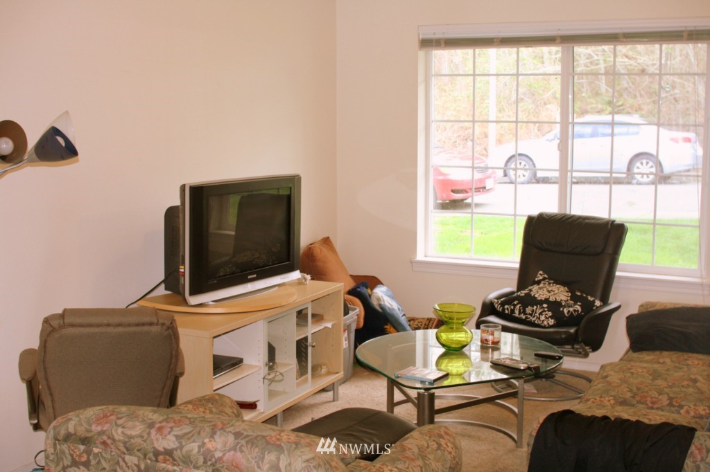 805 Blueberry Lane Bellingham, WA 98229 - Photo 5 of 15 a living room with furniture and a flat screen tv