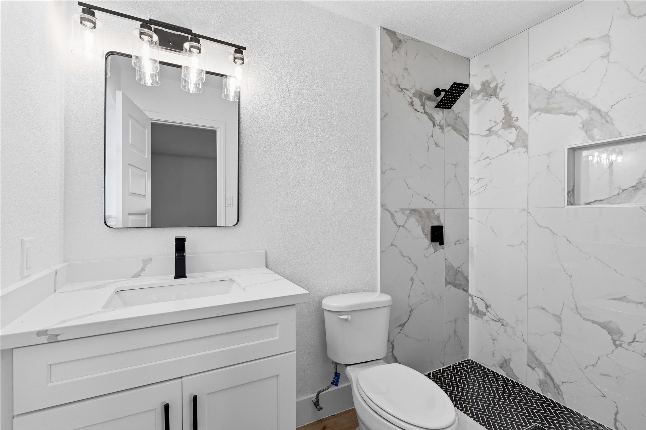 9809 Wren Court Conroe, TX 77385 - Photo 16 of 22 a bathroom with a sink toilet and shower