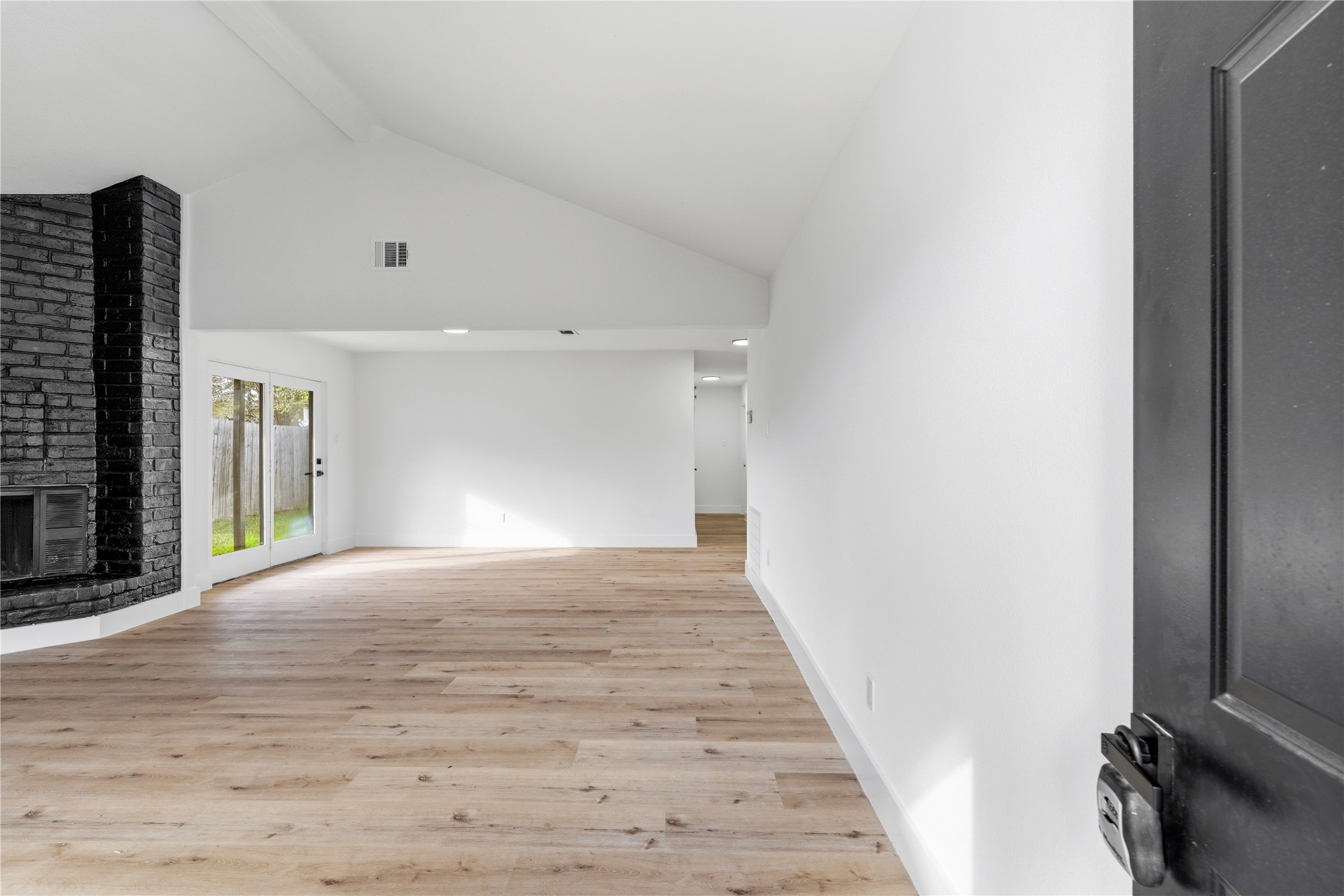 9809 Wren Court Conroe, TX 77385 - Photo 3 of 22 a view of an empty room with wooden floor
