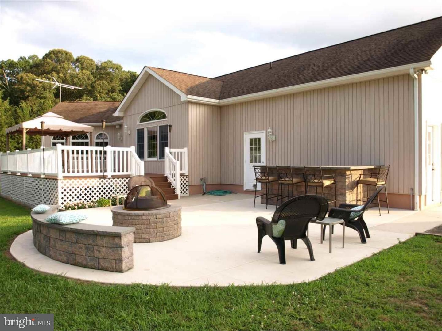 63 Beebe Run Road Bridgeton, NJ 08302 - Photo 4 of 20 a view of a house with backyard and sitting area