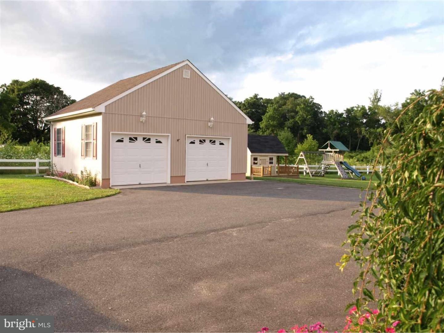 63 Beebe Run Road Bridgeton, NJ 08302 - Photo 5 of 20 a view of a house with a yard and potted plants