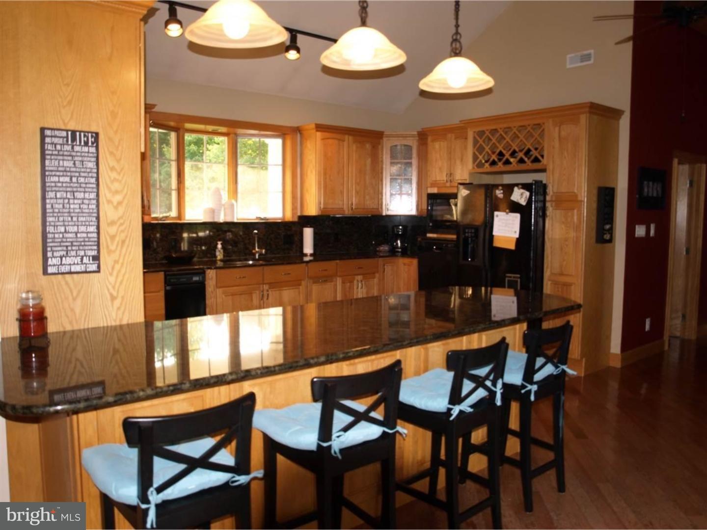 63 Beebe Run Road Bridgeton, NJ 08302 - Photo 6 of 20 a dining table with chairs and wooden floor