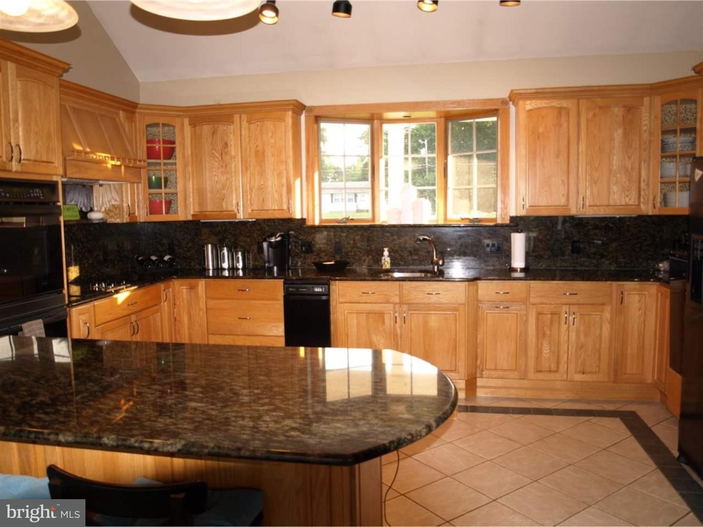63 Beebe Run Road Bridgeton, NJ 08302 - Photo 7 of 20 a view of a kitchen with kitchen island granite countertop a sink and a large window