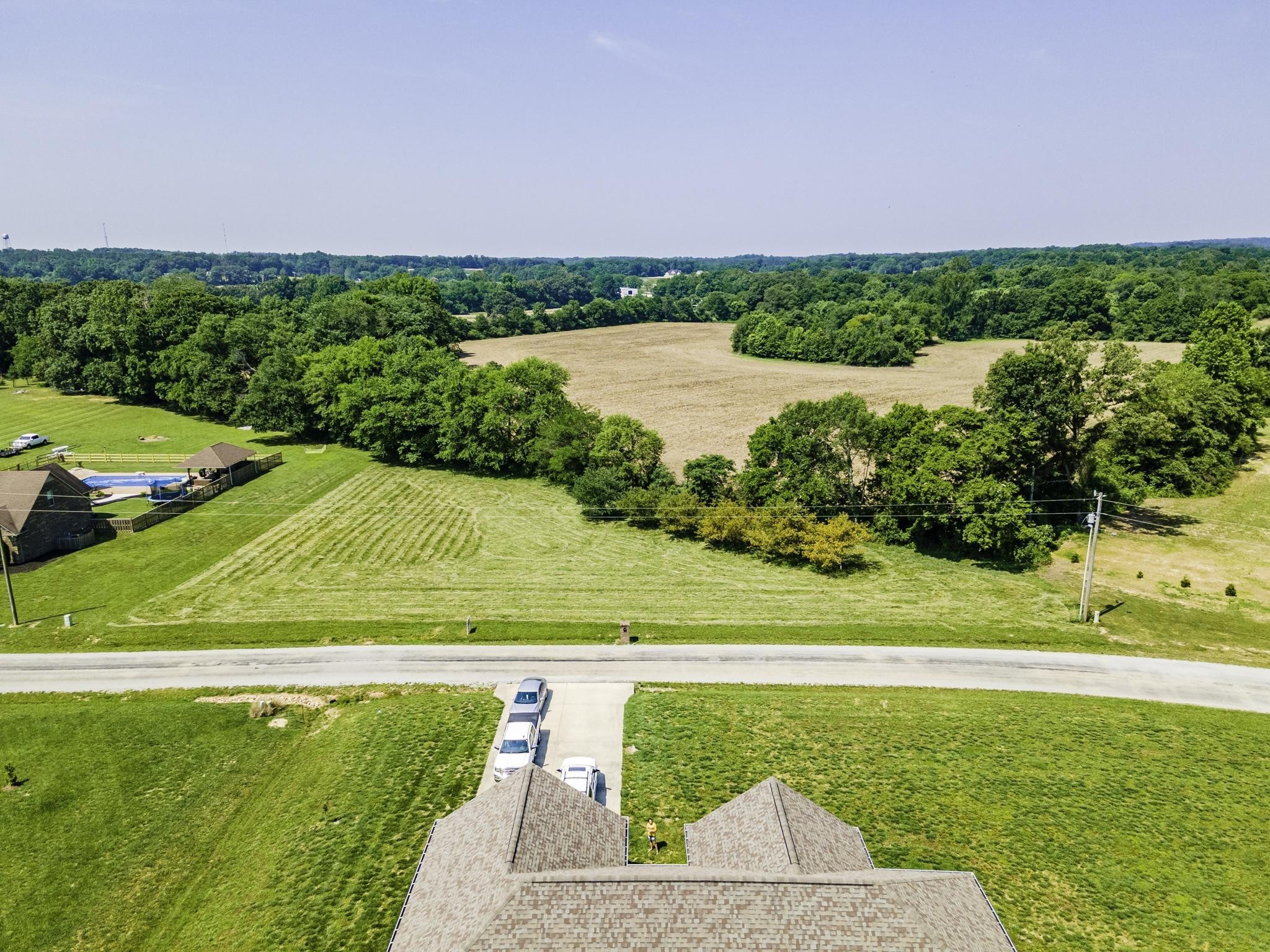 0 Planters Circle Leoma, TN 38468 - Photo 7 of 14 a view of a lake with a yard and large trees