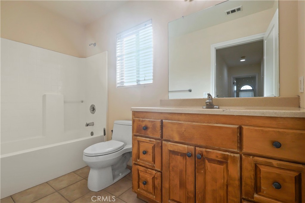 17100 Apple Street Bellflower, CA 90706 - Photo 18 of 38 a bathroom with a sink toilet and shower