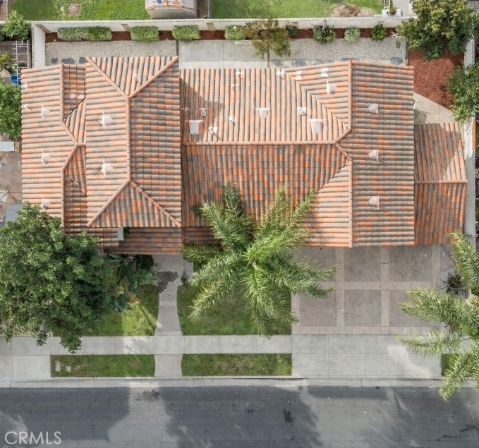 17100 Apple Street Bellflower, CA 90706 - Photo 3 of 38 a view of a house with a yard and potted plants