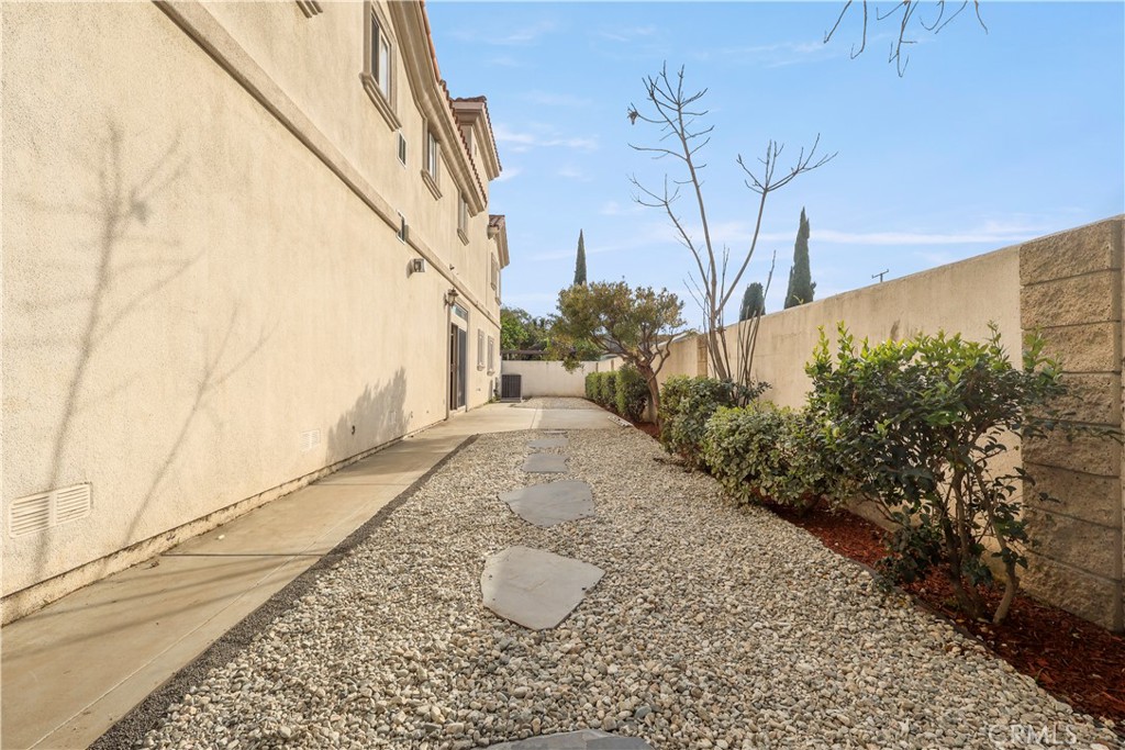 17100 Apple Street Bellflower, CA 90706 - Photo 6 of 38 a view of a backyard with potted plants