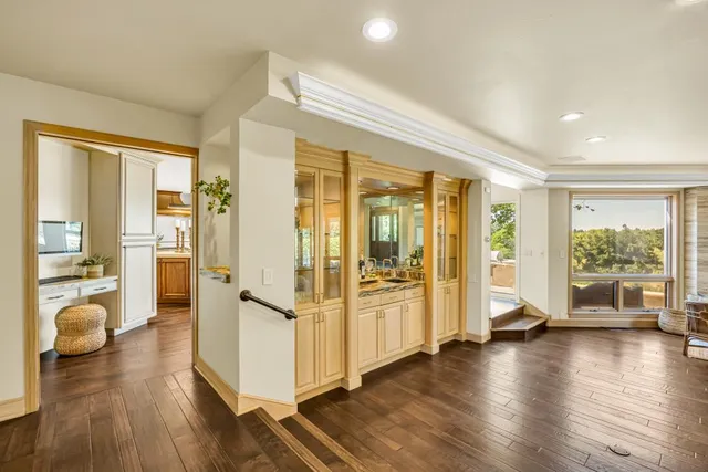 a kitchen with granite countertop stainless steel appliances a white stove top oven and cabinets