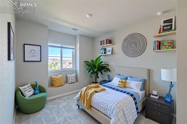 a bedroom with bed and a window