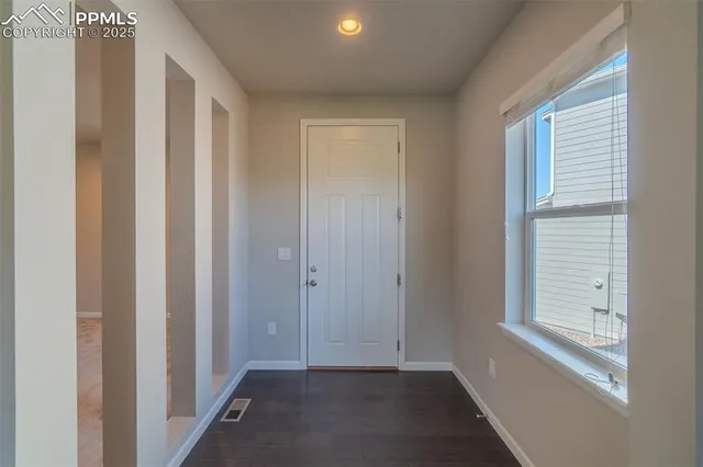 a view of an empty room and window