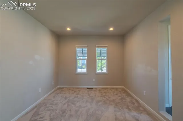 a view of empty room with windows