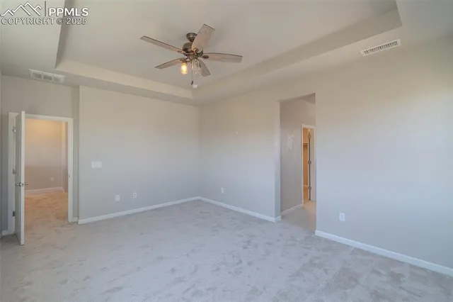a spacious bathroom with a tub sink shower and mirror