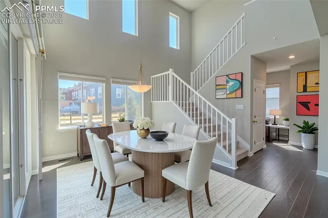 a view of a dining room with furniture window and wooden floor