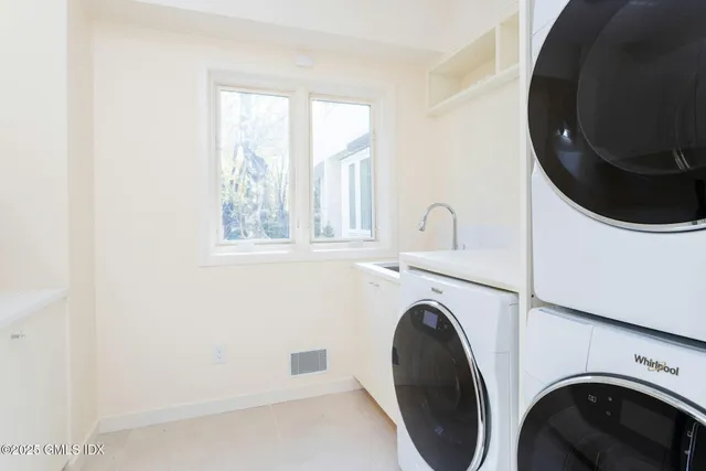 a bedroom with a large bed and a large window