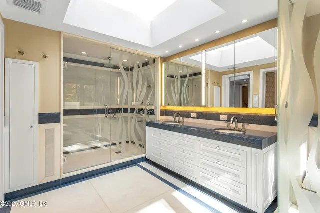 a bathroom with a granite countertop sink a toilet and bathtub