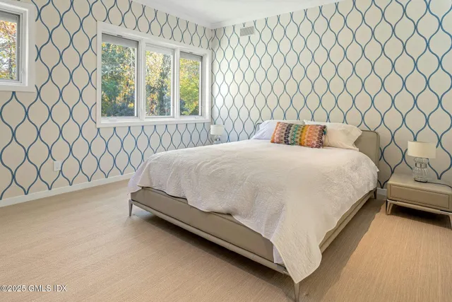 a bedroom with a bed and window