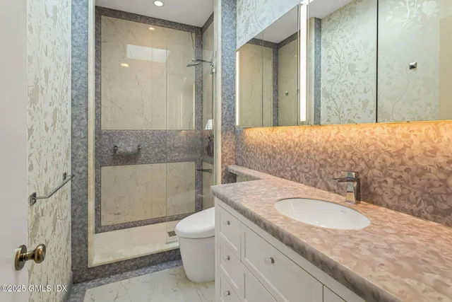 a kitchen with a refrigerator sink and cabinets
