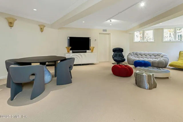 a kitchen with white cabinets and refrigerator