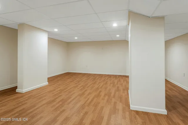 a view of a backyard with wooden fence