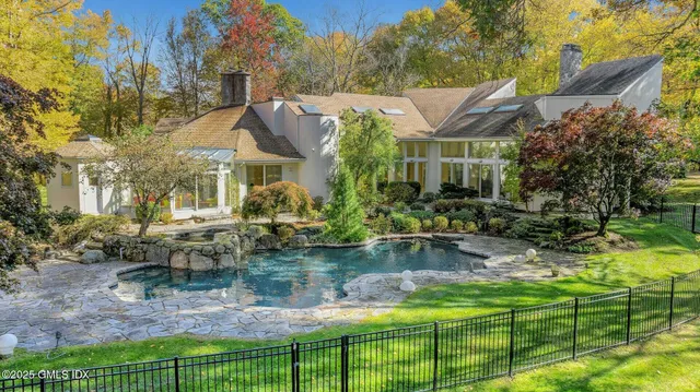 a view of a field with large trees