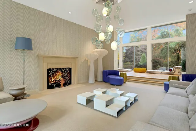 a kitchen that has a sink a stove and a table in it