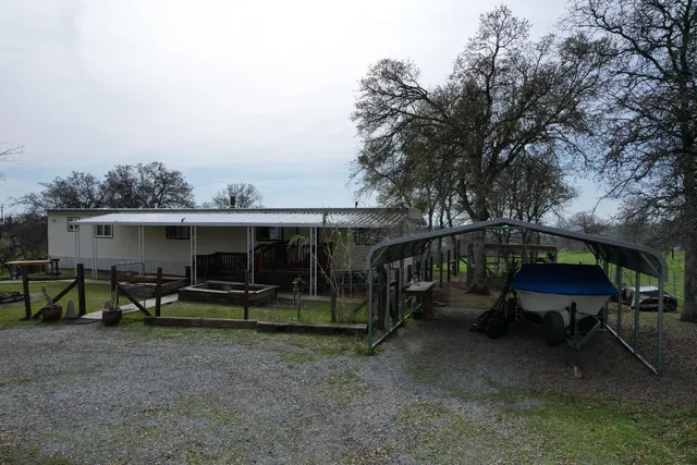 a kitchen with a stove a sink and a microwave