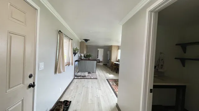 a kitchen with a sink a stove and cabinets