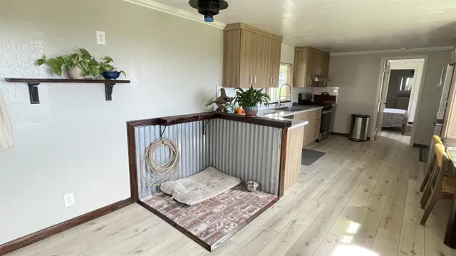 a room with wooden floor and a window