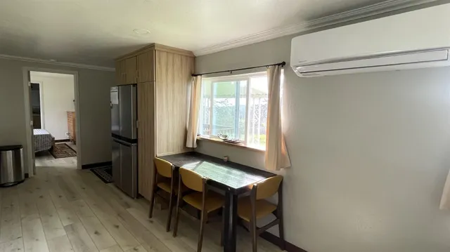 a bathroom with a toilet and a mirror