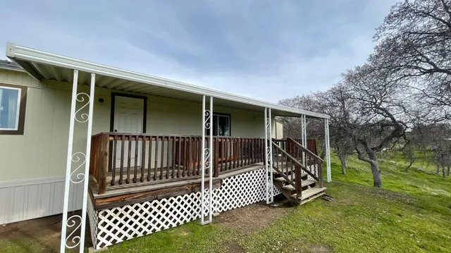 a view of a house with a big yard