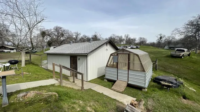 a backyard of a house with lots of green space