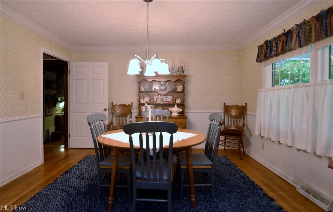 7912 Stow Road Hudson, OH 44236 - Photo 6 of 35 Dining room featuring hardwood flooring and ornamental molding