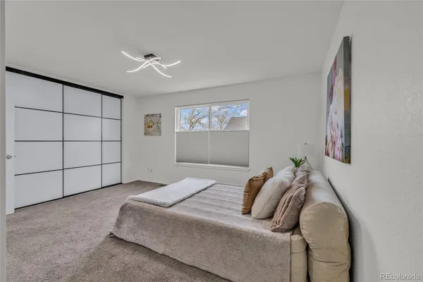 a bedroom with a bed and window