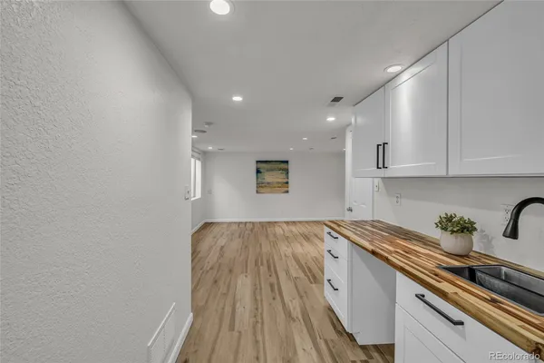a kitchen with a sink and cabinets