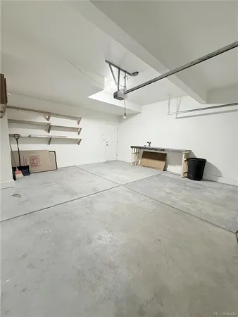 a view of a livingroom with a furniture and kitchen view
