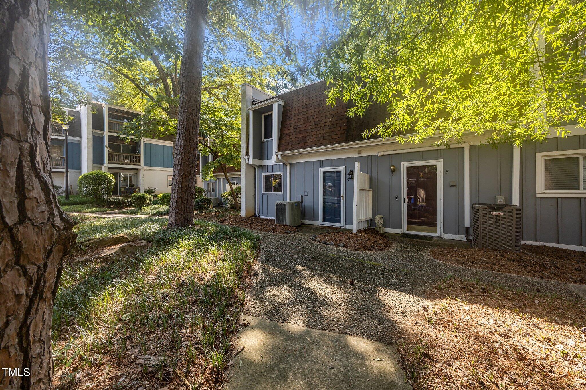 7020 Longstreet Drive, Unit A Raleigh, NC 27615 - Photo 1 of 27 a view of a house with a yard