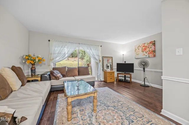 a living room with furniture and a table