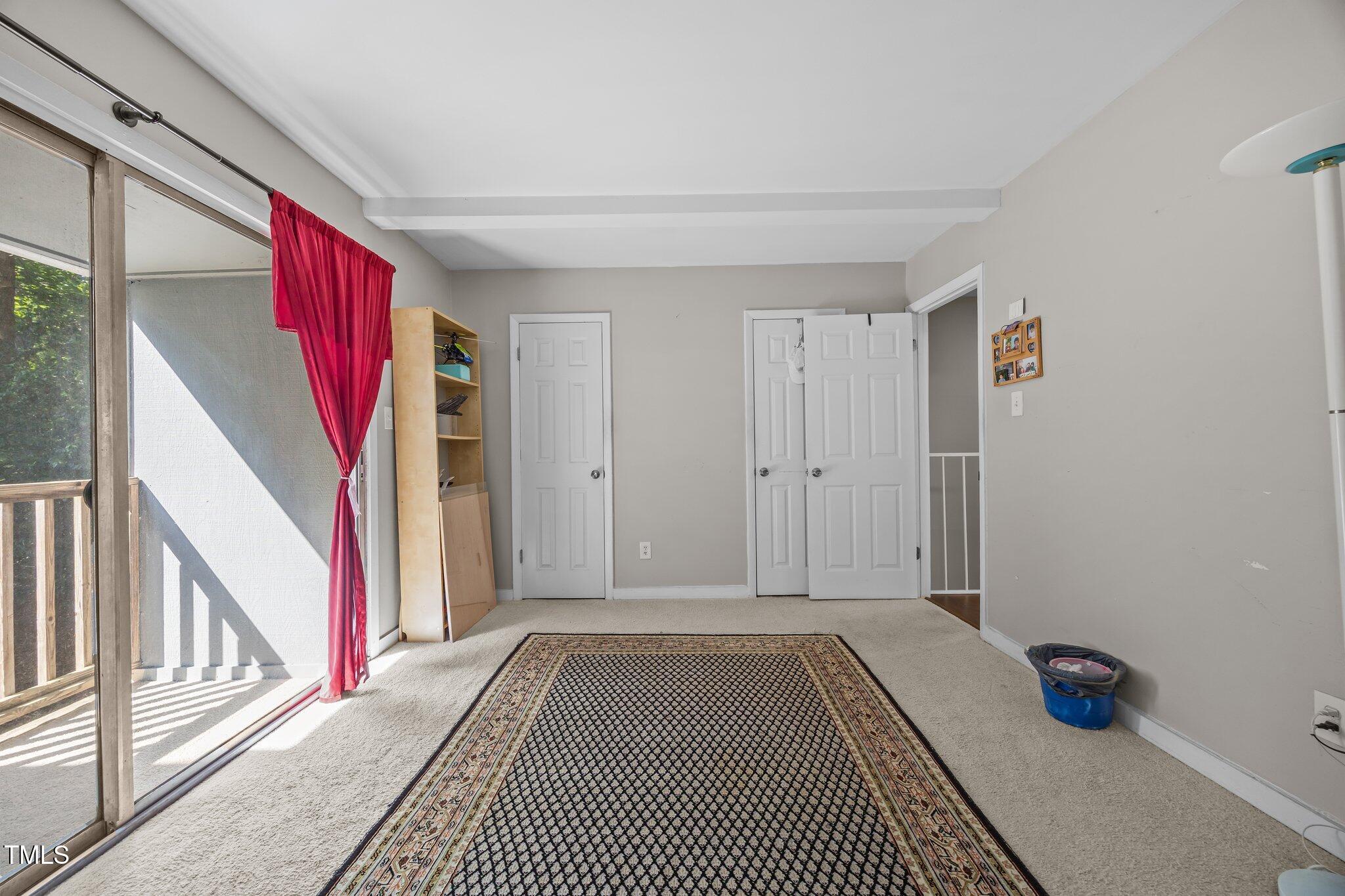 7020 Longstreet Drive, Unit A Raleigh, NC 27615 - Photo 20 of 27 a view of empty room with wooden floor and fan