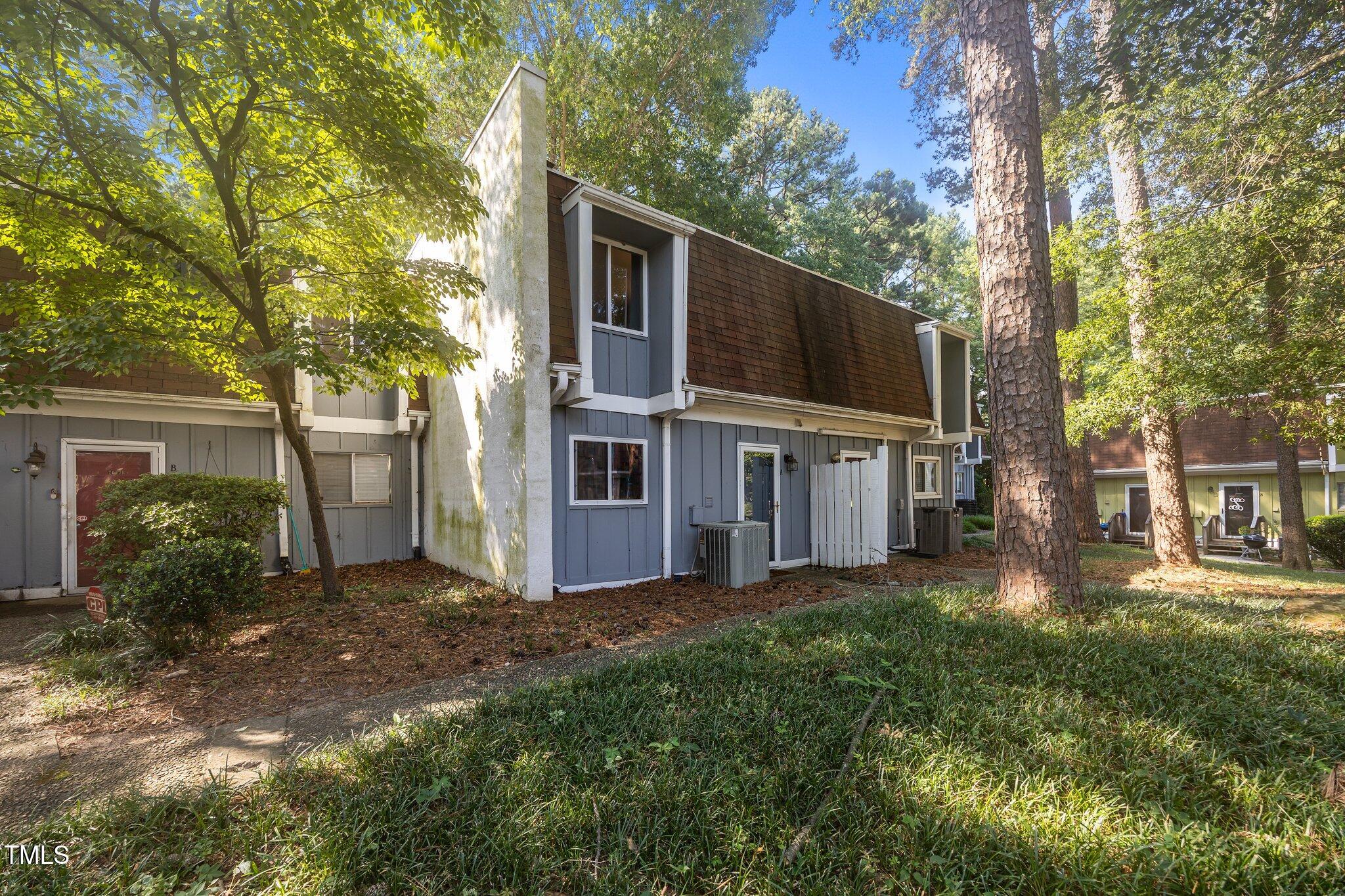 7020 Longstreet Drive, Unit A Raleigh, NC 27615 - Photo 2 of 27 a view of a house with a yard