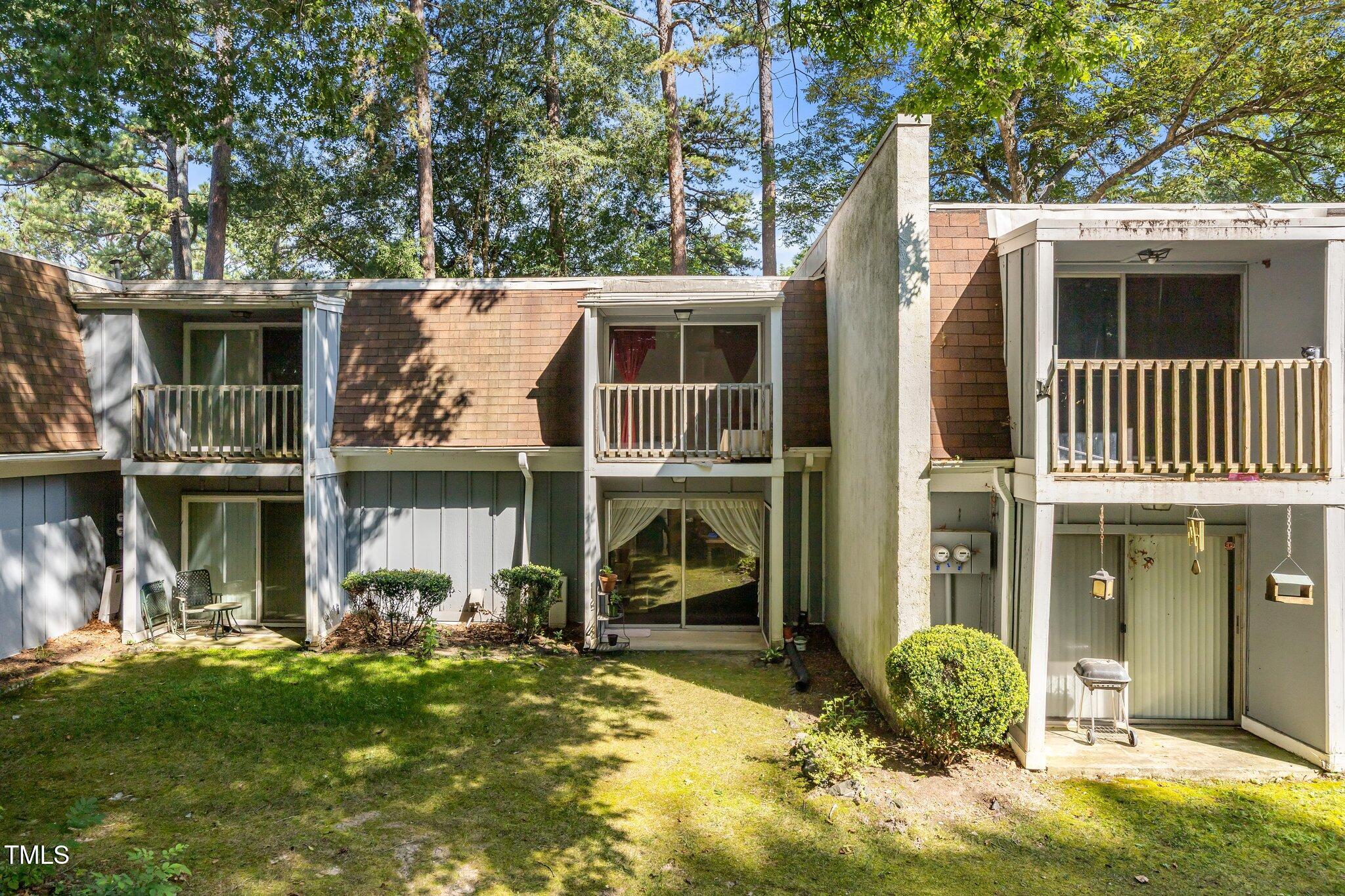 7020 Longstreet Drive, Unit A Raleigh, NC 27615 - Photo 24 of 27 a front view of a house with a yard