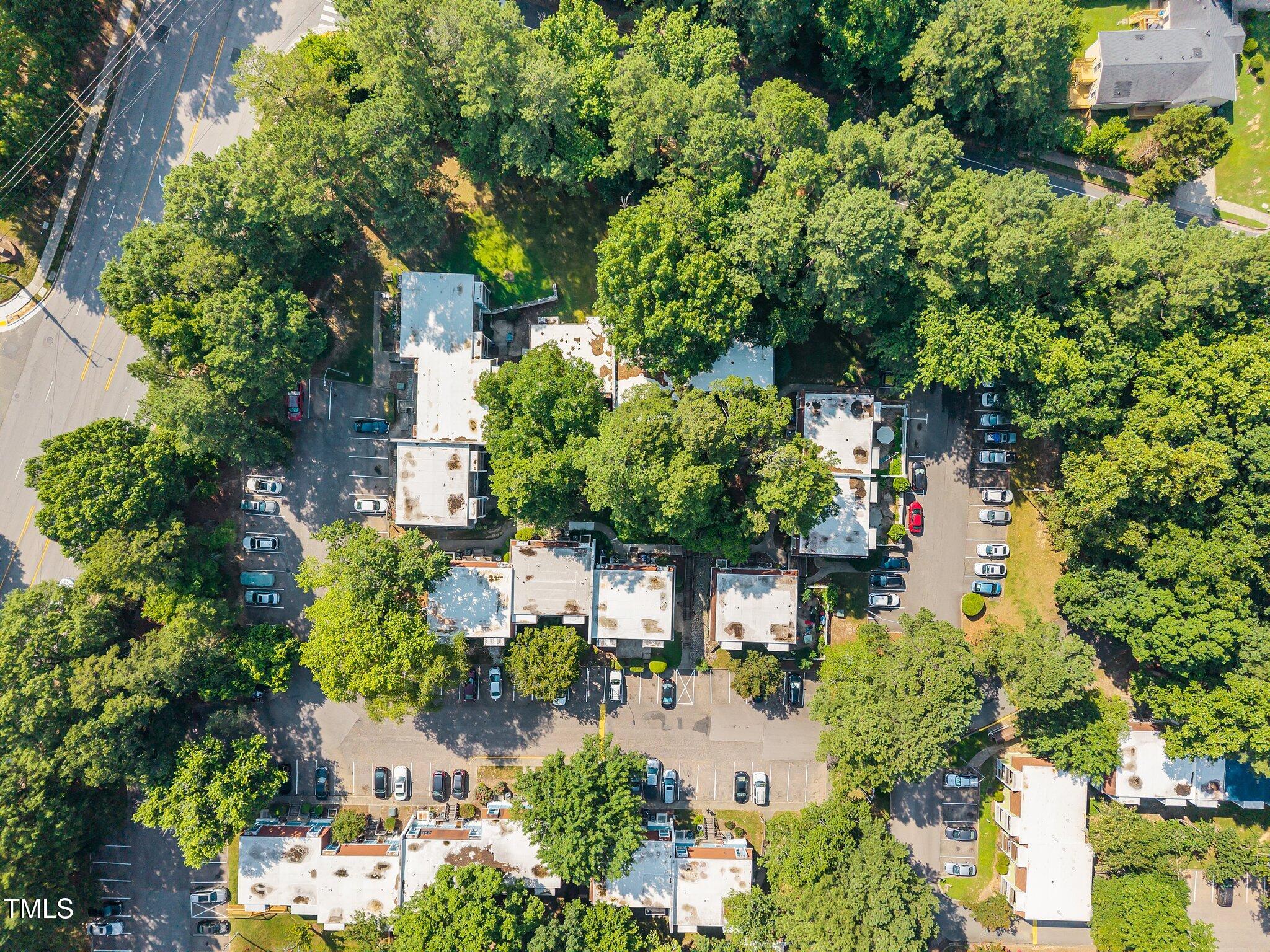 7020 Longstreet Drive, Unit A Raleigh, NC 27615 - Photo 26 of 27 an aerial view of a house with a yard and lake view