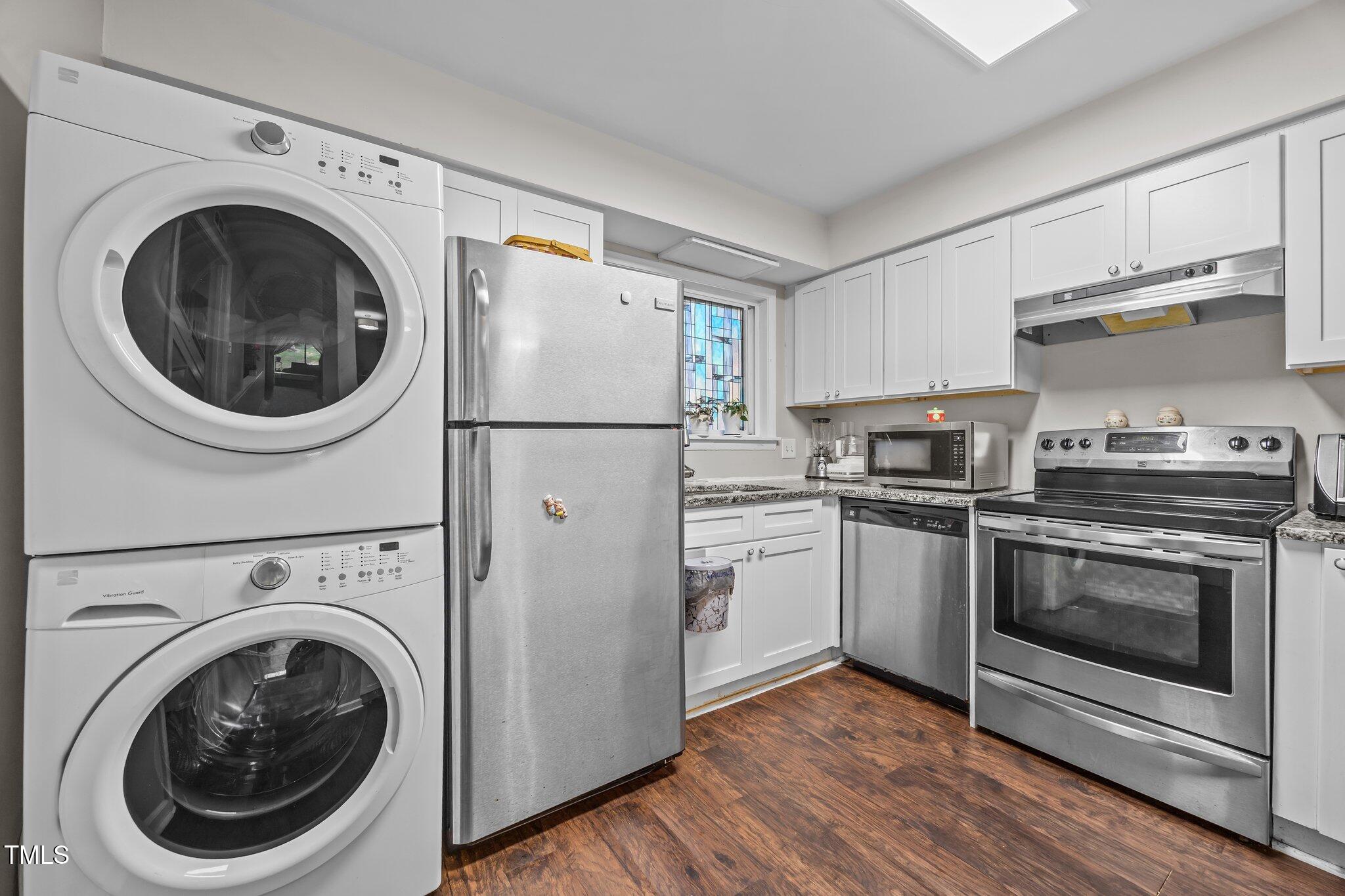7020 Longstreet Drive, Unit A Raleigh, NC 27615 - Photo 5 of 27 a kitchen with a washer and dryer