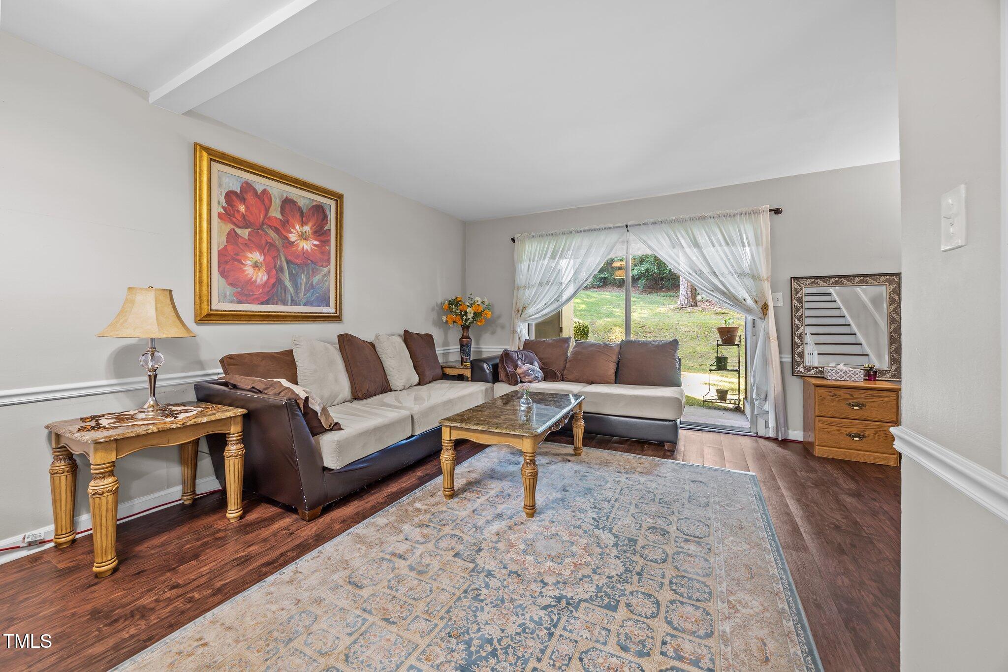 7020 Longstreet Drive, Unit A Raleigh, NC 27615 - Photo 9 of 27 a living room with furniture and a fireplace
